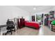 Bedroom with a red and gray bedspread and ample storage at 8004 Tanglewood Ln, Tampa, FL 33615