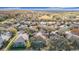 Scenic aerial view of a residential community with lush trees and a golf course at 16829 Midsummer Ln, Spring Hill, FL 34610