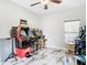 Spacious game room featuring various arcade games, bar stools, and a ceiling fan at 16829 Midsummer Ln, Spring Hill, FL 34610