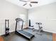 Dedicated home gym with treadmill, weights, and other exercise equipment at 16829 Midsummer Ln, Spring Hill, FL 34610