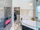 Elegant Primary bath with fireplace, soaking tub, and walk-in closet access at 16829 Midsummer Ln, Spring Hill, FL 34610