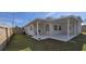 Backyard featuring a covered patio, ideal for enjoying the outdoors while protected from the elements at 1722 St Croix Dr, Clearwater, FL 33759