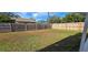 Large fenced backyard with ample green space for outdoor activities and entertaining at 1722 St Croix Dr, Clearwater, FL 33759