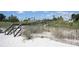 Beach access with wooden boardwalk and dune walkover at 1722 St Croix Dr, Clearwater, FL 33759