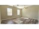 Bright bedroom with wood-look floors, a ceiling fan, and plenty of natural light at 1722 St Croix Dr, Clearwater, FL 33759