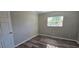 This bedroom has wood-look floors and fresh paint at 1722 St Croix Dr, Clearwater, FL 33759