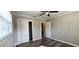 Bedroom with wood-look floors, closet, and ceiling fan at 1722 St Croix Dr, Clearwater, FL 33759