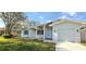 Charming single-story home with a well-maintained lawn and attached garage at 1722 St Croix Dr, Clearwater, FL 33759