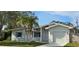 Beautiful single-Gathering home with a lush lawn, attached garage, and pleasing architectural design at 1722 St Croix Dr, Clearwater, FL 33759