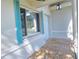 Close up of the front porch with a large picture window and blue shutters at 1722 St Croix Dr, Clearwater, FL 33759
