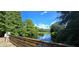 Scenic lake view from a wooden bridge, showcasing lush greenery and calm waters, perfect for nature enthusiasts at 1722 St Croix Dr, Clearwater, FL 33759