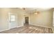 Bright living area with light walls, wood-look floors and an exterior door with window at 1722 St Croix Dr, Clearwater, FL 33759