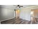 Open living space with hardwood floors, neutral walls, and multiple entryways at 1722 St Croix Dr, Clearwater, FL 33759