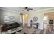 Comfortable living room with wood-look floors, ceiling fan, and neutral wall colors at 1722 St Croix Dr, Clearwater, FL 33759