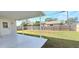 Open patio overlooking a fenced backyard, perfect for outdoor entertaining and relaxation at 1722 St Croix Dr, Clearwater, FL 33759