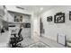 Organized home office featuring desk, printer, and wall-mounted storage at 36750 Us Highway 19 N # 06110, Palm Harbor, FL 34684