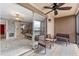 Balcony with seating, ceiling fan, and view of living area at 6321 Newtown Cir # 21B4, Tampa, FL 33615