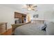Inviting main bedroom with wooden furniture, ceiling fan, and access to a private balcony at 6321 Newtown Cir # 21B4, Tampa, FL 33615