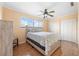 Cozy bedroom with a ceiling fan, ample closet space, and natural light at 6321 Newtown Cir # 21B4, Tampa, FL 33615