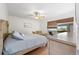 Bedroom with king-size bed, wooden furniture, and sliding glass door at 6321 Newtown Cir # 21B4, Tampa, FL 33615