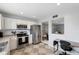 Kitchen with dining area view, workspace, and stainless steel appliances at 6321 Newtown Cir # 21B4, Tampa, FL 33615