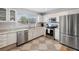 Modern kitchen with stainless steel appliances and white cabinetry at 6321 Newtown Cir # 21B4, Tampa, FL 33615