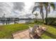 Backyard with waterfront views and seating area at 637 Pinellas Bayway S # 111, St Petersburg, FL 33715
