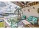 Screened balcony with seating area and serene water views at 637 Pinellas Bayway S # 111, St Petersburg, FL 33715