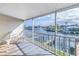 Screened-in balcony with waterfront views and outdoor furniture at 637 Pinellas Bayway S # 111, St Petersburg, FL 33715