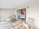 Balcony with seating, overlooking the bedroom through a sliding glass door at 637 Pinellas Bayway S # 111, St Petersburg, FL 33715