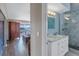 View from doorway showing bedroom into on suite bathroom, dual sinks and walk-in shower at 637 Pinellas Bayway S # 111, St Petersburg, FL 33715