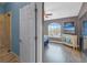 View of bedroom from doorway, showing TV and large window at 637 Pinellas Bayway S # 111, St Petersburg, FL 33715