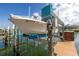 Boat lift with a boat stored out of the water on a canal at 637 Pinellas Bayway S # 111, St Petersburg, FL 33715