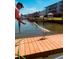 A Personal feeding a bird on a dock overlooking the waterway at 637 Pinellas Bayway S # 111, St Petersburg, FL 33715