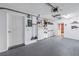 Garage interior with refrigerator, storage, and access door at 637 Pinellas Bayway S # 111, St Petersburg, FL 33715