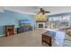Living room with fireplace, tile floor, sliding glass doors to balcony, and water views at 637 Pinellas Bayway S # 111, St Petersburg, FL 33715