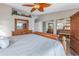 Main bedroom featuring wooden furniture, ceiling fan, and mirrored closet doors at 637 Pinellas Bayway S # 111, St Petersburg, FL 33715