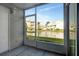 Screened-in balcony overlooking a pond and other condo buildings at 6923 Stonesthrow N Cir # 4105, St Petersburg, FL 33710