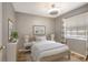 Cozy bedroom with wood-frame bed, striped bedding, and beachy decor at 6923 Stonesthrow N Cir # 4105, St Petersburg, FL 33710