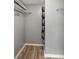 Walk-in closet with built-in shelving and hanging rods at 6923 Stonesthrow N Cir # 4105, St Petersburg, FL 33710