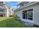 Exterior view of a condo with a screened-in porch and green lawn at 6923 Stonesthrow N Cir # 4105, St Petersburg, FL 33710