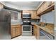 Updated kitchen with stainless steel appliances and granite countertops at 6923 Stonesthrow N Cir # 4105, St Petersburg, FL 33710