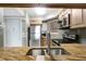 Kitchen with granite countertops, stainless steel appliances, and a pass-through window at 6923 Stonesthrow N Cir # 4105, St Petersburg, FL 33710