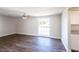 Light-filled living room featuring wood-look floors at 7335 Canal Blvd, Tampa, FL 33615