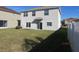 Large backyard with grassy area at 7423 Pulteney Dr, Zephyrhills, FL 33545