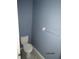 Simple and clean bathroom with light blue walls at 7423 Pulteney Dr, Zephyrhills, FL 33545