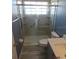 Bathroom with walk-in shower and gray tile flooring at 7423 Pulteney Dr, Zephyrhills, FL 33545