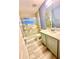 Bright bathroom features a walk-in shower, vanity with quartz countertop, and modern fixtures at 7423 Pulteney Dr, Zephyrhills, FL 33545