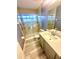 This bathroom features a walk-in shower, sleek vanity, and a well-lit mirror at 7423 Pulteney Dr, Zephyrhills, FL 33545
