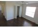 A cozy bedroom features laminate flooring, a ceiling fan, a window, and a closet at 7423 Pulteney Dr, Zephyrhills, FL 33545